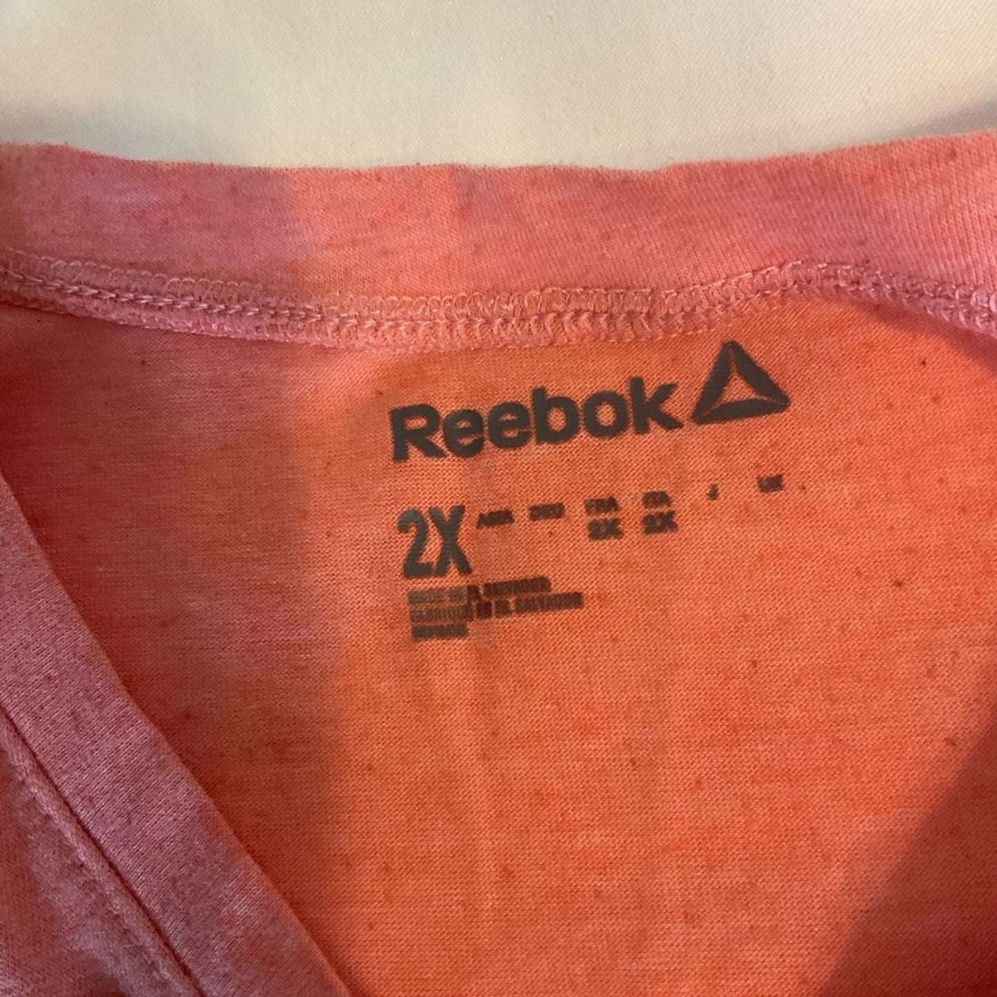 Reebok Tank Top in an orange color.
