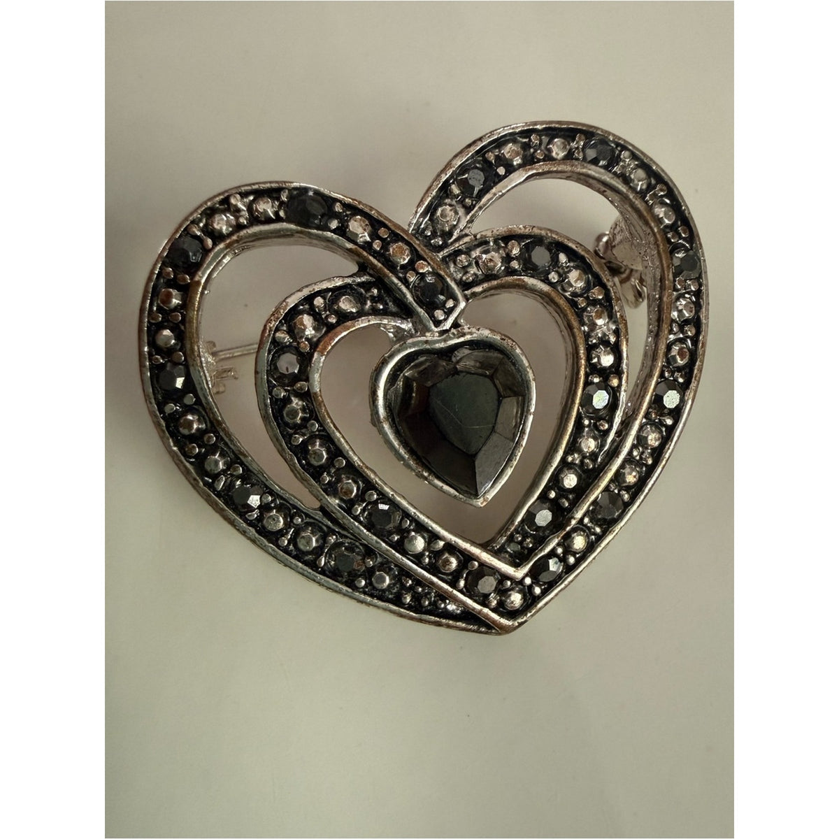 Vintage rhinestone Heart shape silvertone Filigree Brooch with gray/black Stones