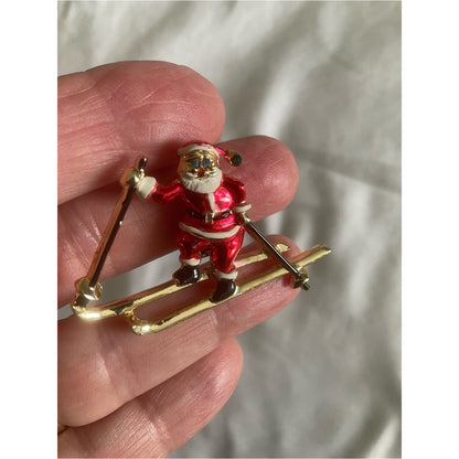 Vintage signed BJ skiing Santa Claus gold tone brooch/pin