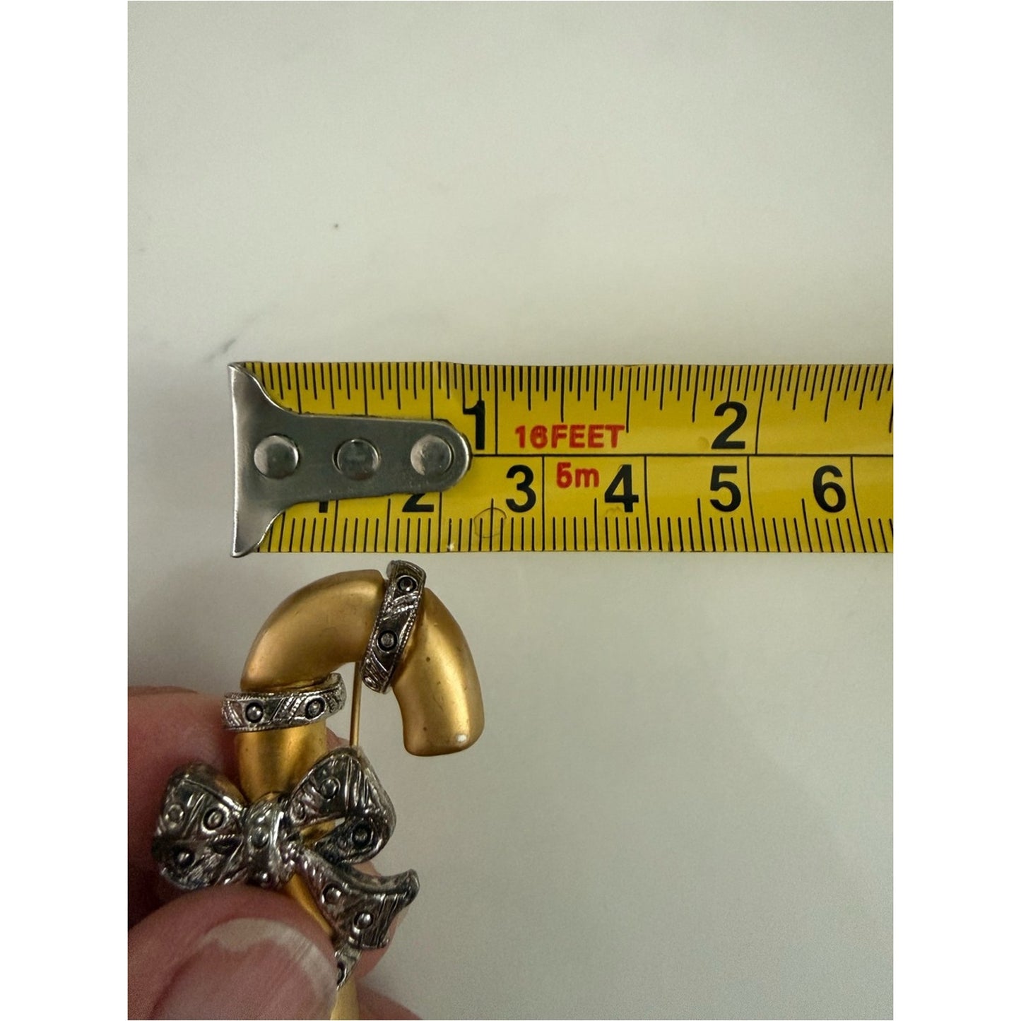 Gold-tone Candy Cane Brooch with Pewter Bow Accent