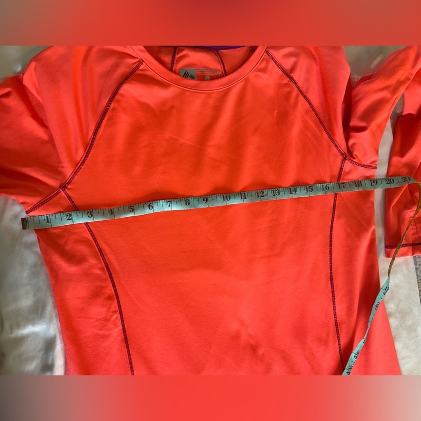 RBX Performance Athletic top with long sleeves and thumb holes.