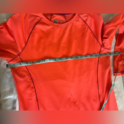 RBX Performance Athletic top with long sleeves and thumb holes.