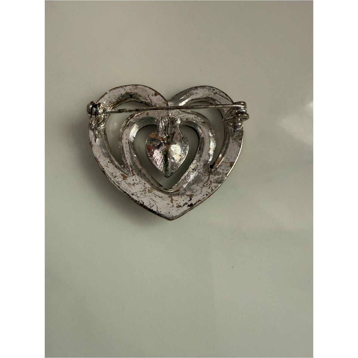 Vintage rhinestone Heart shape silvertone Filigree Brooch with gray/black Stones