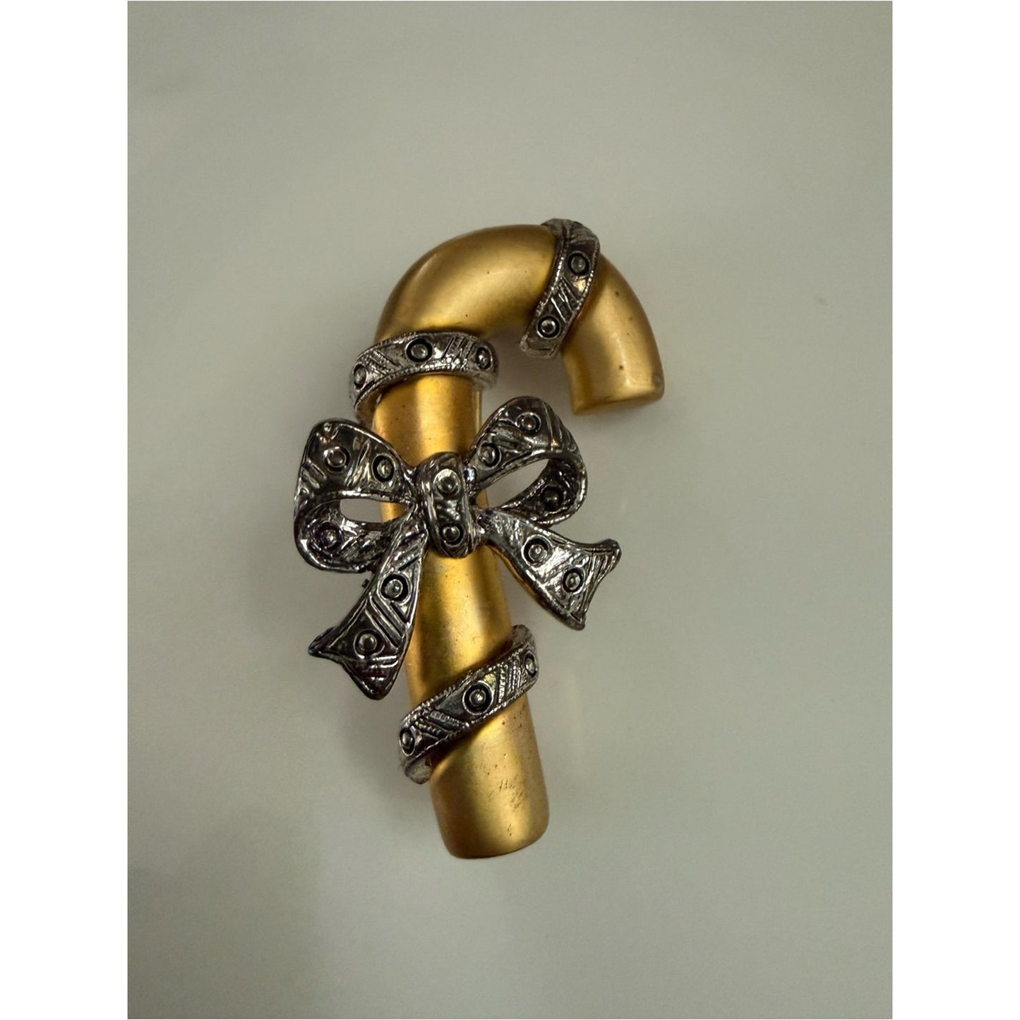 Gold-tone Candy Cane Brooch with Pewter Bow Accent