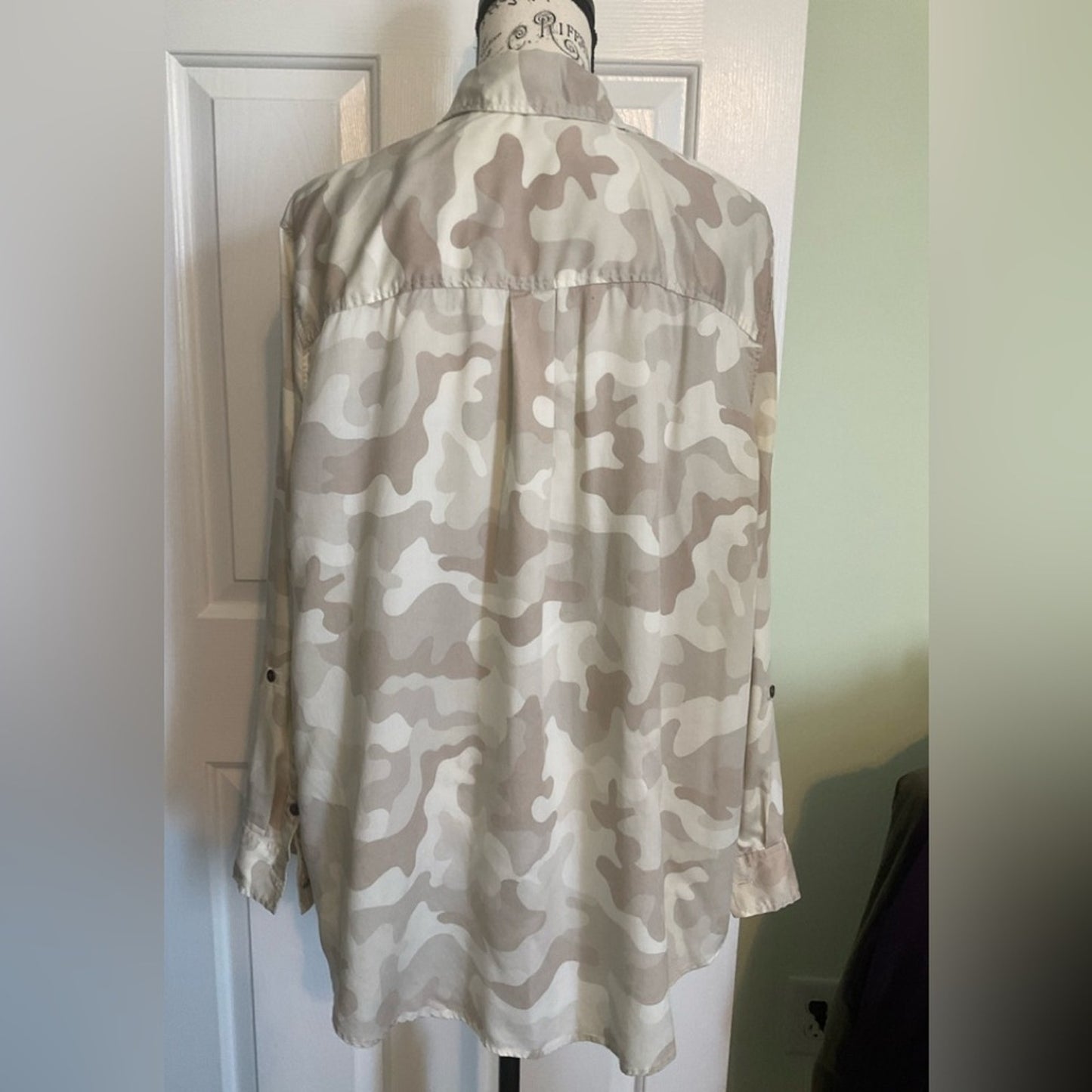 New Directions women’s camo style button down blouse with roll sleeves.