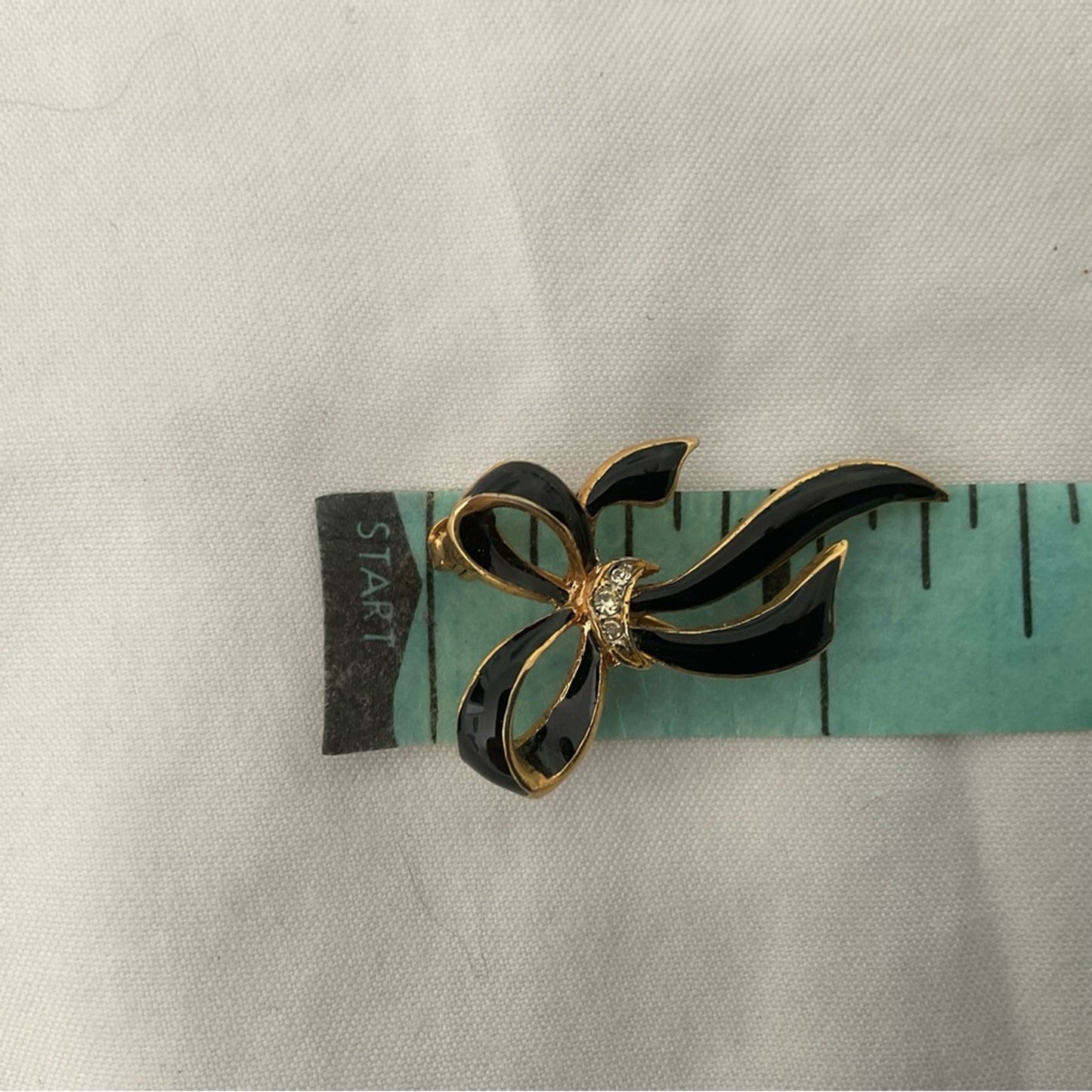 Elegant Black and Gold Bow Brooch