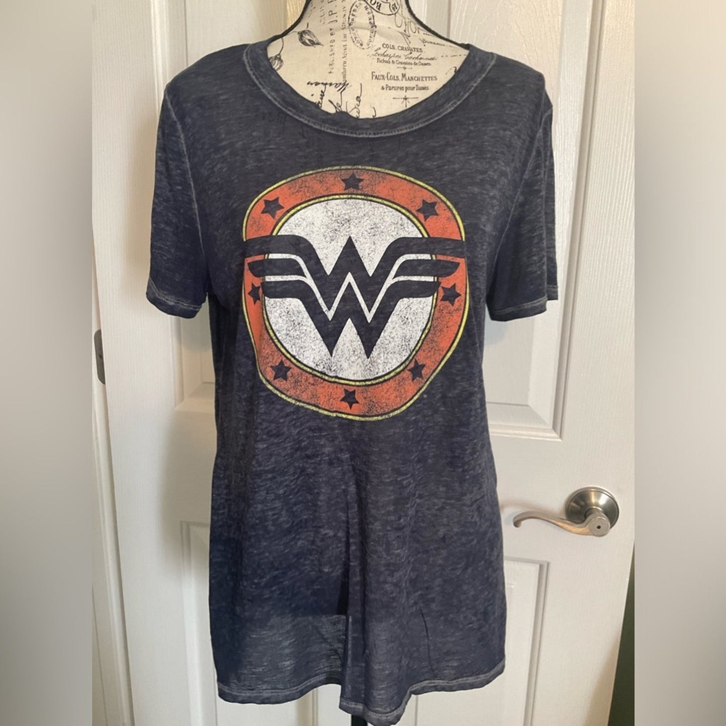 Wonder Woman short sleeve t-shirt in a blue color with the WW emblem.