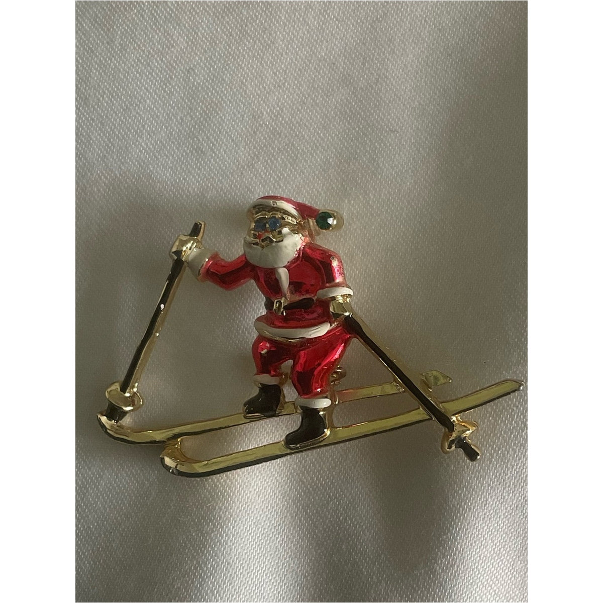 Vintage signed BJ skiing Santa Claus gold tone brooch/pin