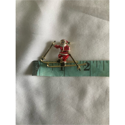 Vintage signed BJ skiing Santa Claus gold tone brooch/pin