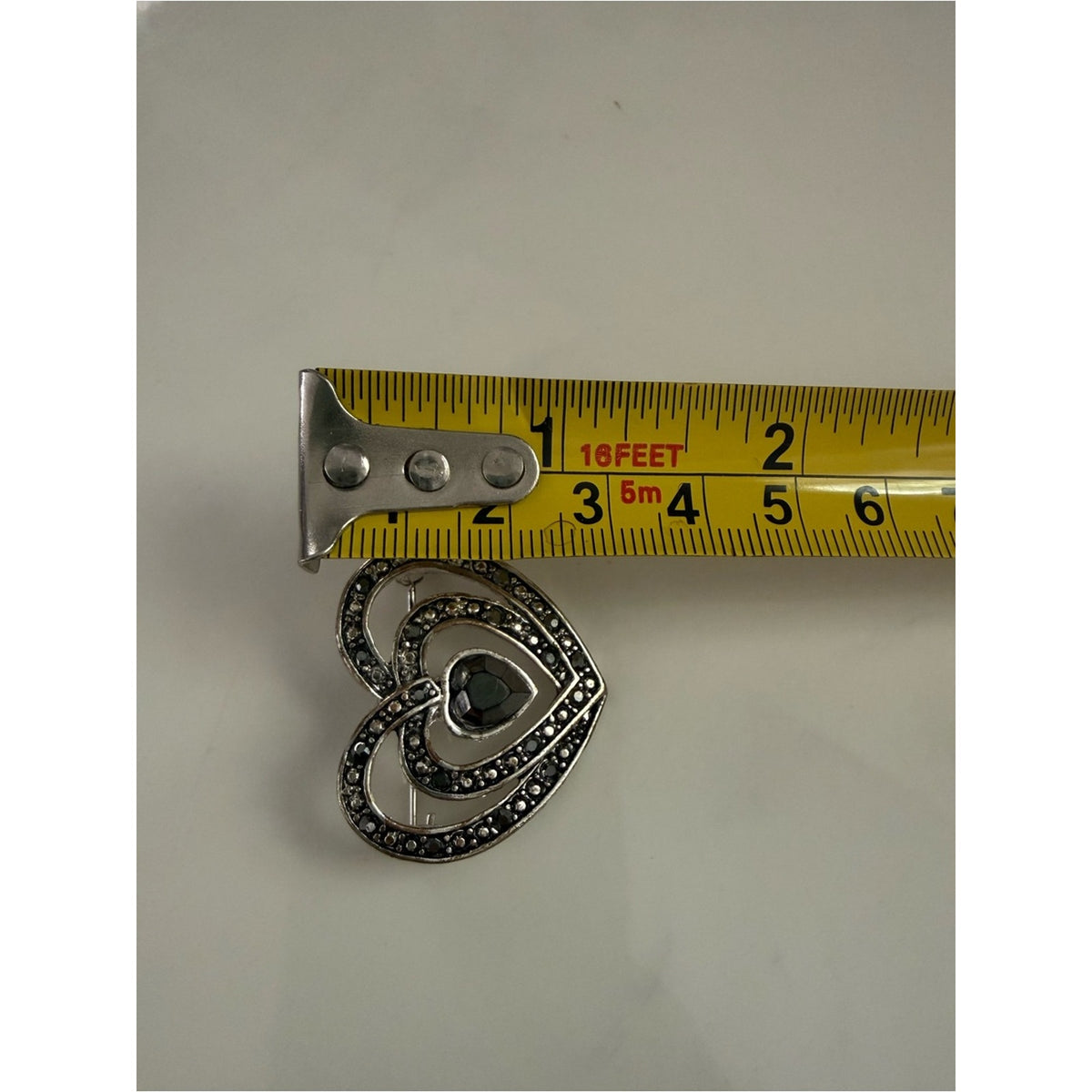 Vintage rhinestone Heart shape silvertone Filigree Brooch with gray/black Stones