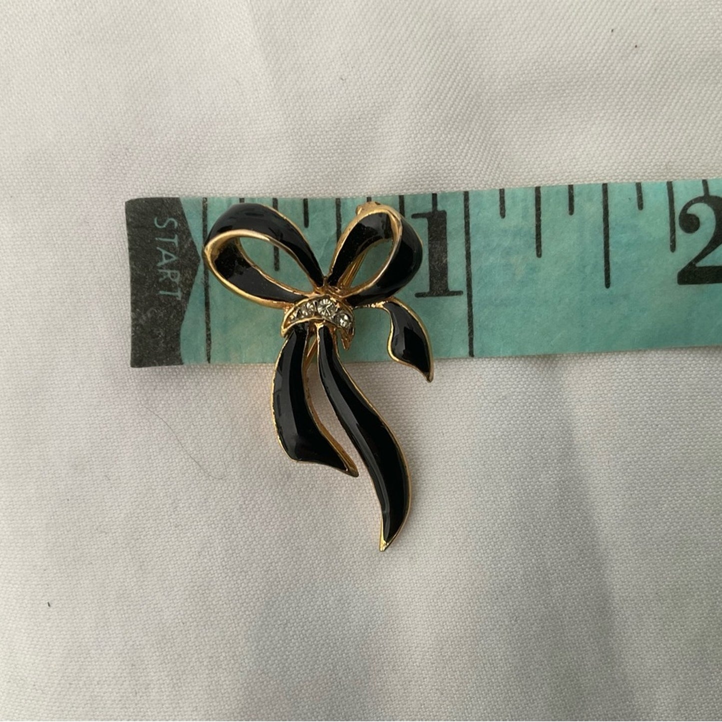 Elegant Black and Gold Bow Brooch