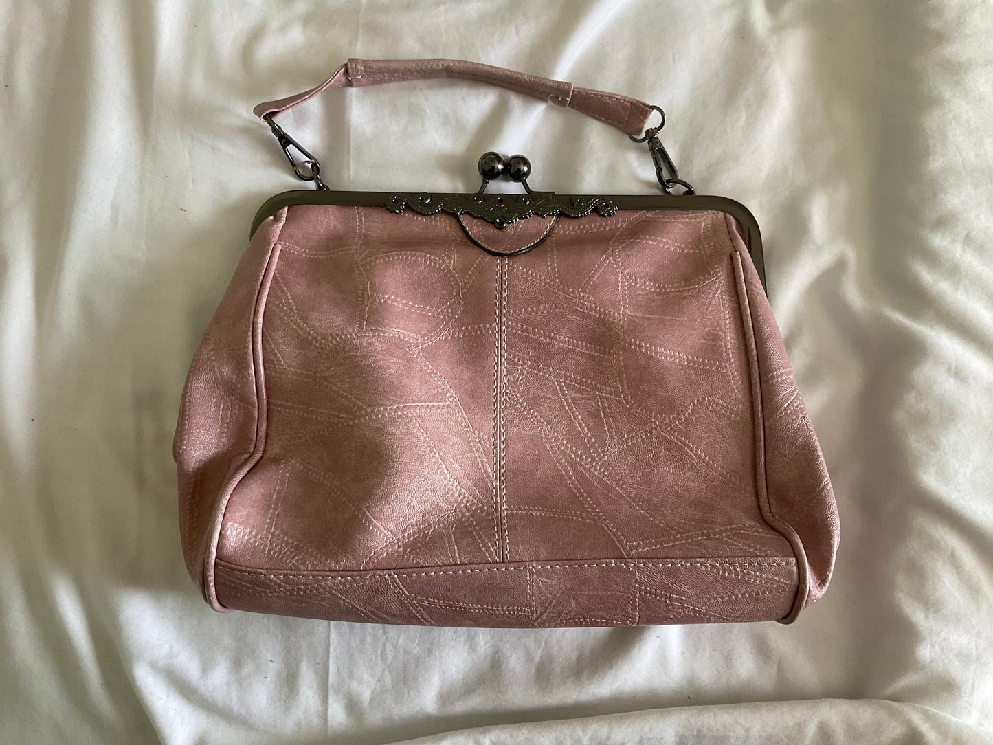 Elegant Pink Frame-Top Wristlet Clutch with Subtle Stitch Detailing