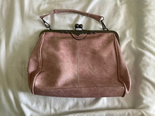 Elegant Pink Frame-Top Wristlet Clutch with Subtle Stitch Detailing