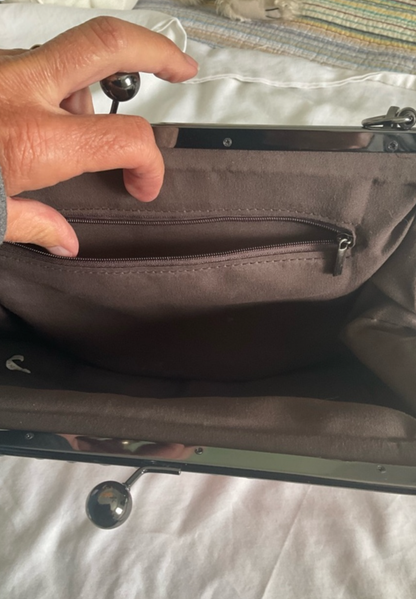 Elegant Pink Frame-Top Wristlet Clutch with Subtle Stitch Detailing