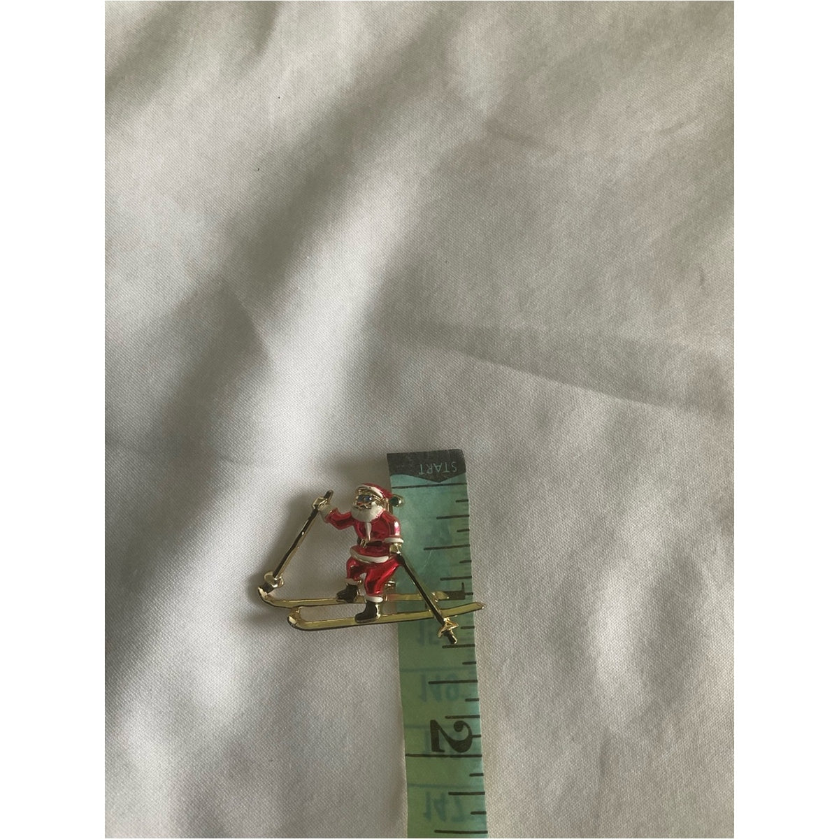 Vintage signed BJ skiing Santa Claus gold tone brooch/pin